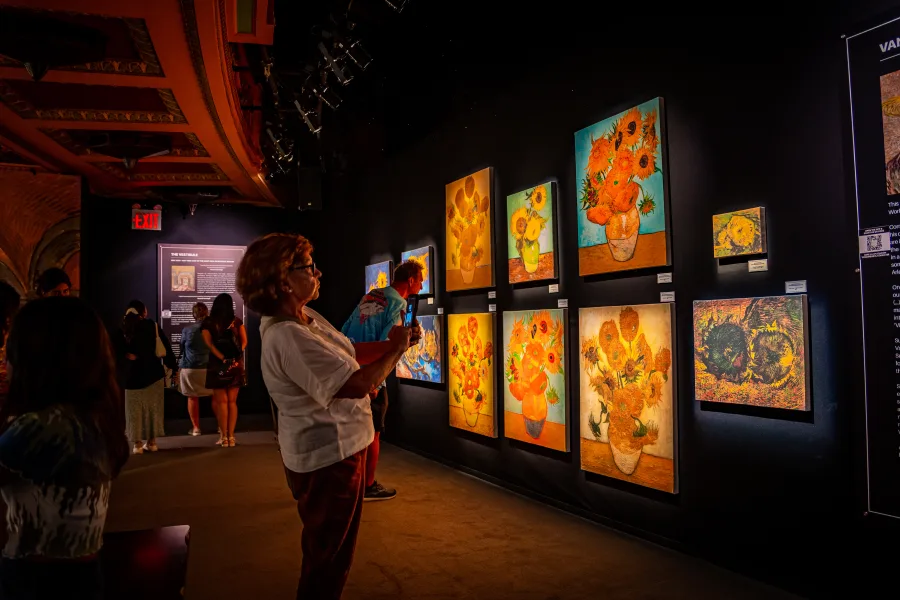 Visitors walking through the Almond Blossom room